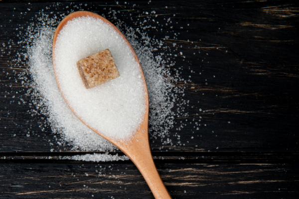 White sugar on a spoon.
