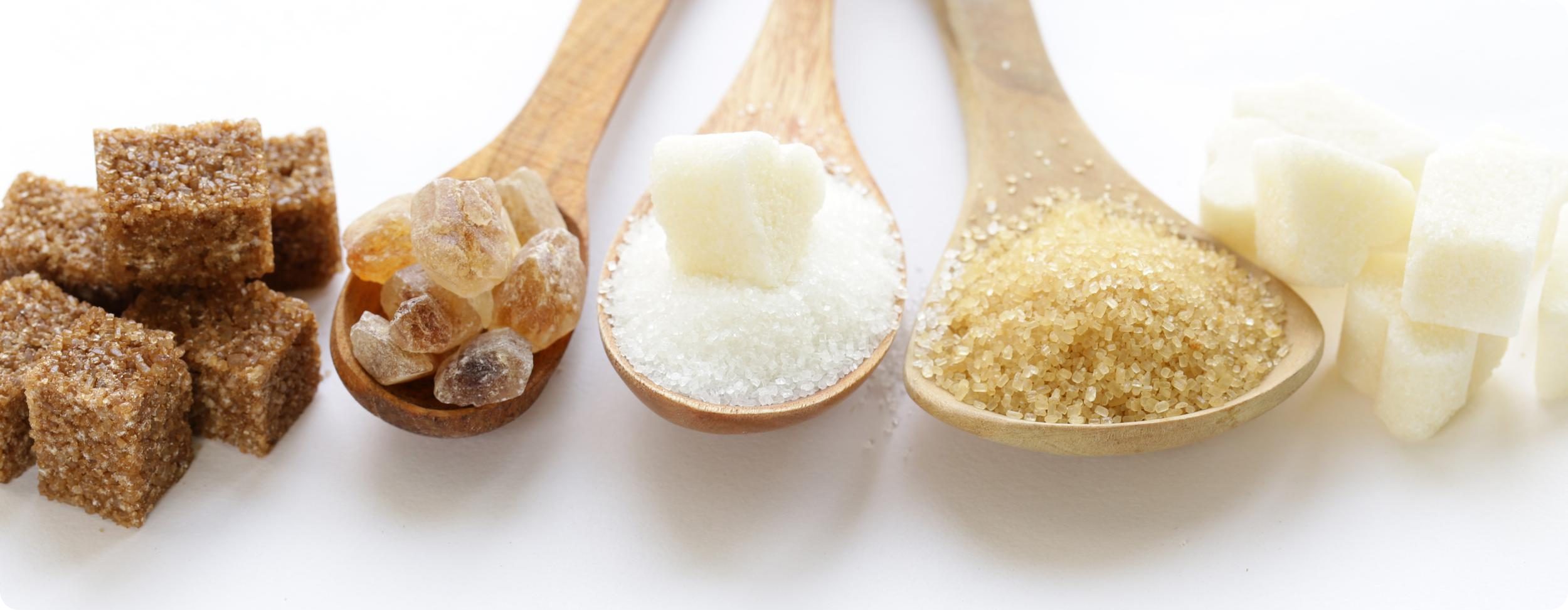 White sugar on a spoon.